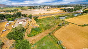 Aerial view featuring a rural view and a water and mountain view