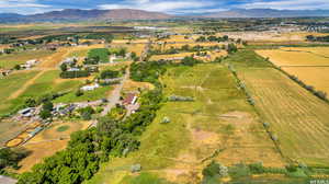 Birds eye view of property featuring a mountain view and a rural view