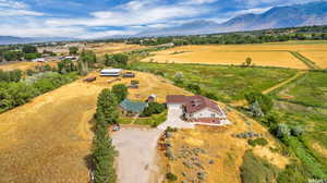 Aerial view featuring a rural view and a mountain view