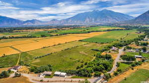 Birds eye view of property featuring a mountain view and a rural view