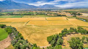 Birds eye view of property with a rural view and a mountain view