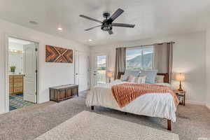 Carpeted bedroom featuring access to exterior, recessed lighting, ensuite bathroom, a ceiling fan, and baseboards