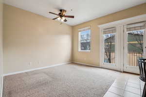 Spare room with ceiling fan and light carpet