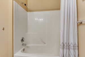 Full bathroom featuring shower / tub combo