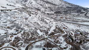 Snowy aerial view featuring a mountain view