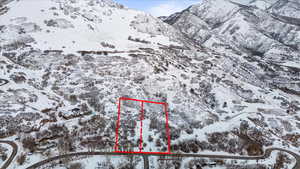 Snowy aerial view featuring a mountain view