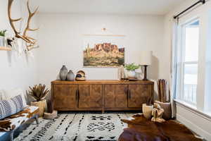 Sitting room featuring baseboards