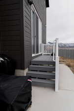 Wooden terrace with a patio area and fence