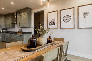 Dining space featuring recessed lighting, light wood finished floors, and baseboards