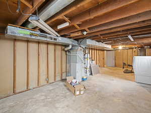 Unfinished basement with washer / dryer