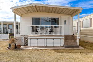 Exterior space featuring a porch and a lawn