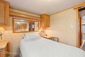 Bedroom featuring ornamental molding