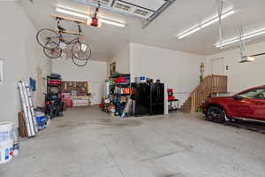 Garage featuring a garage door opener