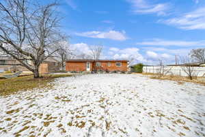 There is a concrete patio on the back for BBQ gatherings, firepit time and maybe some cafe lights