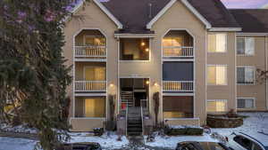 View of front of house featuring a shingled roof