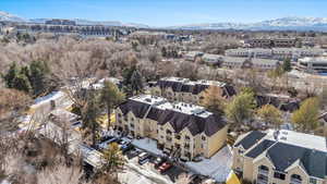 Birds eye view of property with a residential view and a mountain view