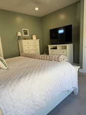 Bedroom featuring carpet, ceiling fan, and recessed lighting