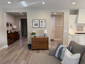 Interior space featuring recessed lighting, baseboards, and light wood finished floors