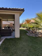 View of yard with a patio area, fence, and outdoor lounge area