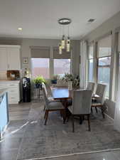 Dining area featuring recessed lighting, visible vents, baseboards, and wood finished floors