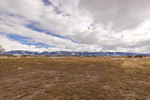 Property view of mountains with a rural view