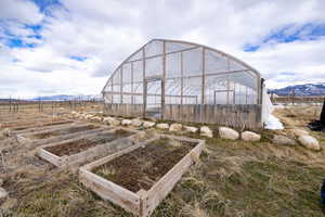 View of green house with planter boxes on east side of property