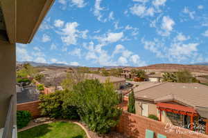 Property view of mountains with a residential view