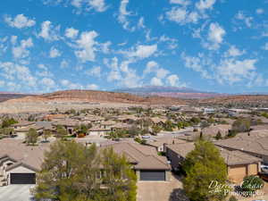 Property view of mountains with a residential view