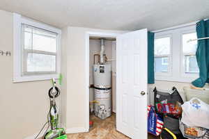 Pantry with strapped water heater