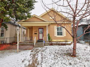 Bungalow-style home with fence