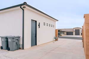 View of side of home with stucco siding