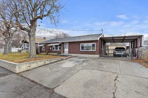 All brick home w/ 2 car carport