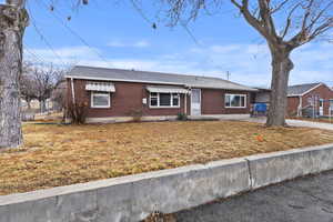 All brick exterior featuring a brand new roof