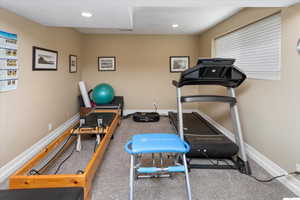 Current a Workout room featuring baseboards, recessed lighting, and carpet flooring