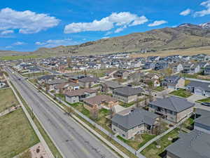 Birds eye view of property featuring a mountain view and a residential view
