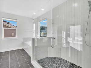 Bathroom with a garden tub,  a walk in showe, and tile floors