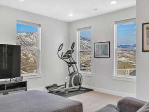 Living Room with workout area with mountain views