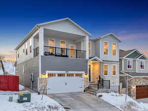 View of front of house with a balcony