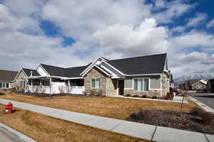 View of front of house featuring a front lawn