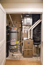 Utility room featuring gas water heater