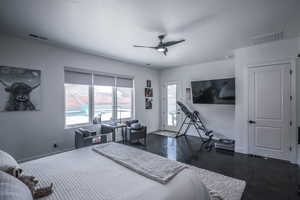 Bedroom featuring access to exterior, a ceiling fan, visible vents, and baseboards