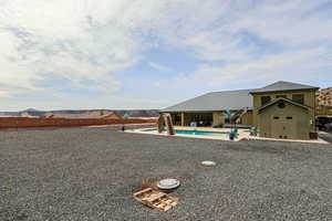 Exterior space with a fenced in pool, fence, and a patio