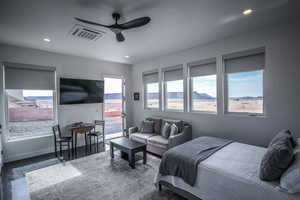 Bedroom with recessed lighting, visible vents, baseboards, access to outside, and dark wood finished floors