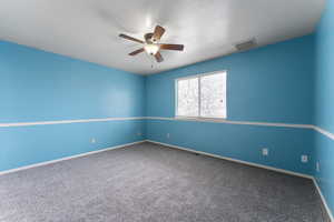 Room featuring a ceiling fan, carpet, visible vents, and baseboards