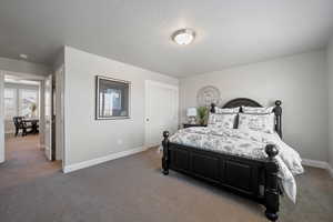 Bedroom with a closet and carpet floors