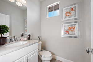 Bathroom featuring toilet and vanity