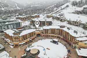 Snowy aerial view with a mountain view