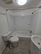 Full bathroom with shower / bathtub combination, sink, and toilet