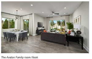 Living room with baseboards, with notable chandelier, wood laminate flooring, and recessed lighting