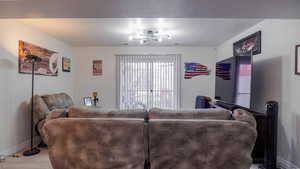 Living area featuring light wood-style floors, baseboards, and visible vents